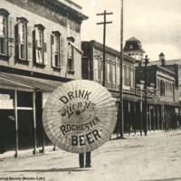 Advertising umbrella, 200 block Middle Street, ca. 1901