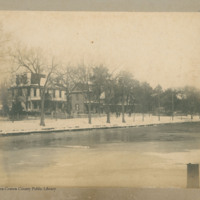 East Front Street view, 400 block, snow scene and frozen river